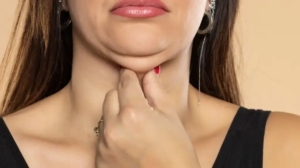 An image of a woman with double chin, sad, worried : Non Surgical Double Chin Removal Treatment in Wibsey, UK