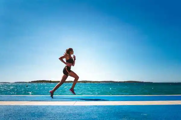 Woman running showing strong leg muscle Wibsey